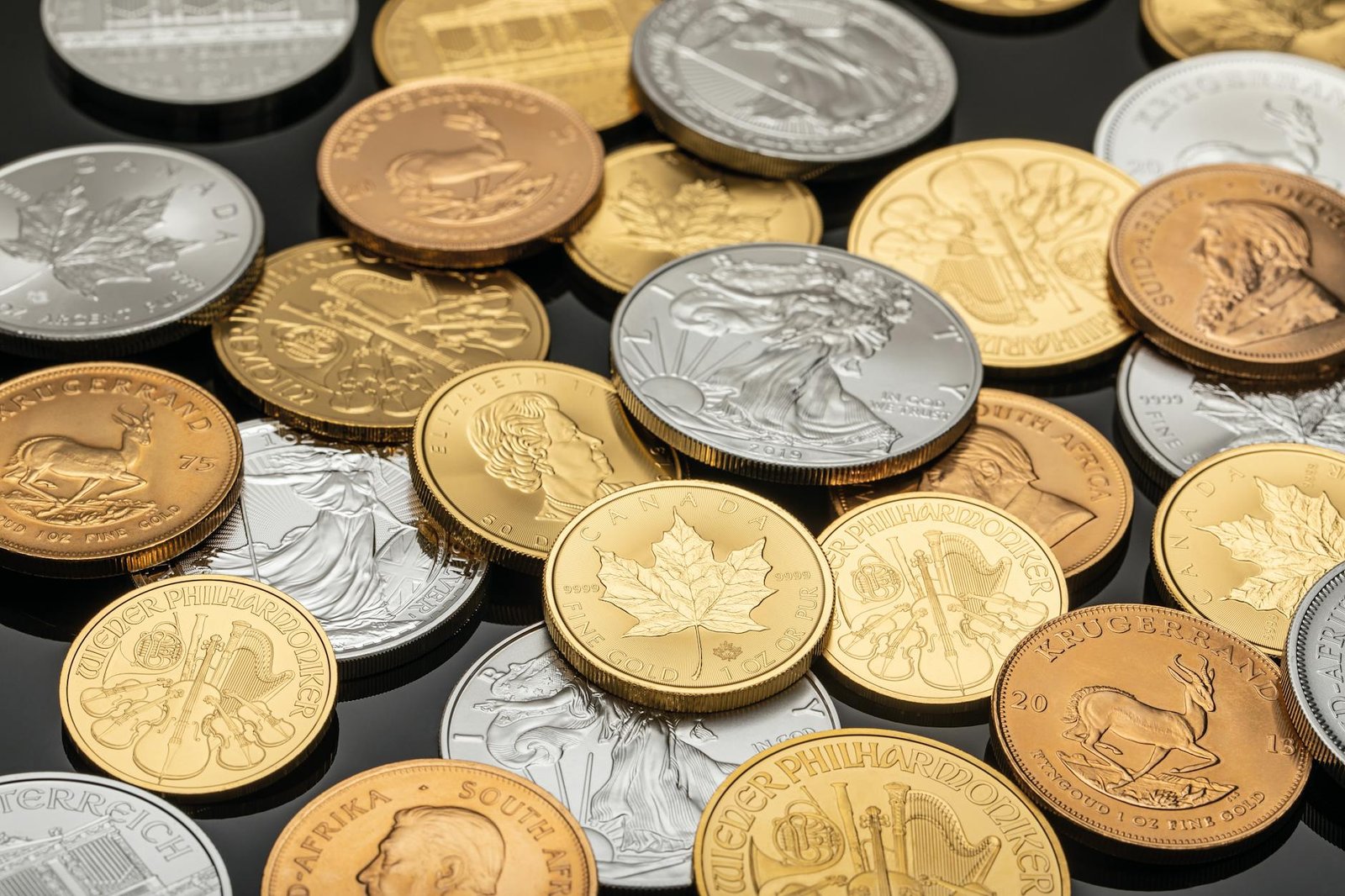 Gold and silver bars side by side comparing precious metals investments
